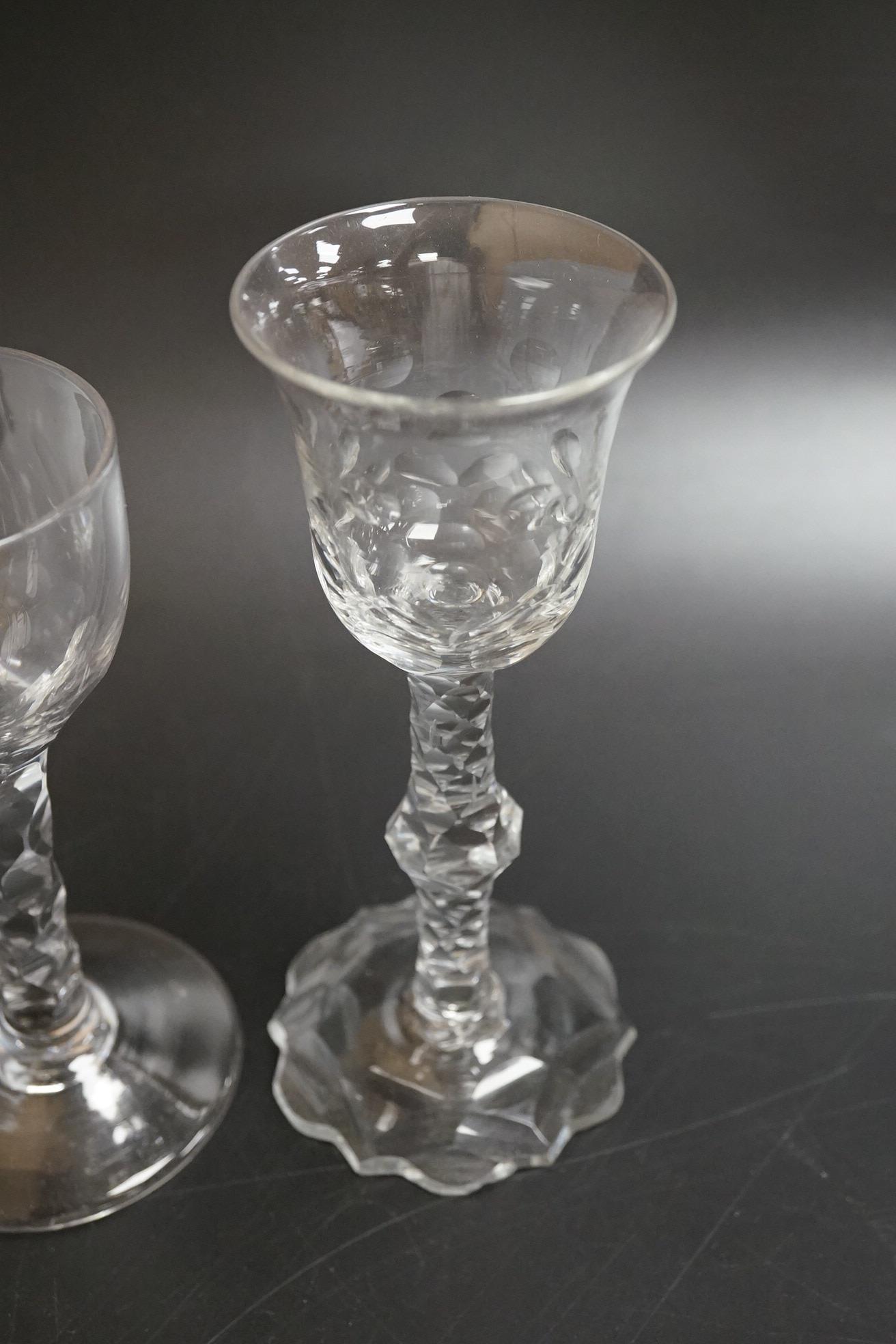 Two faceted wine glasses, c.1775, one with faceted star cut foot, tallest 15cm